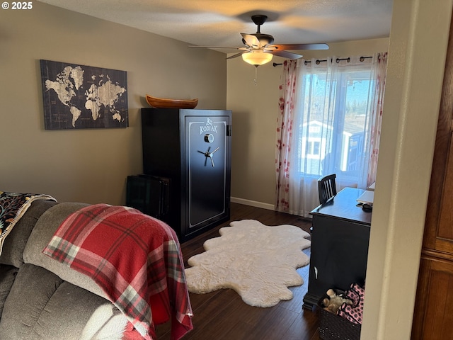 bedroom featuring ceiling fan and dark hardwood / wood-style floors