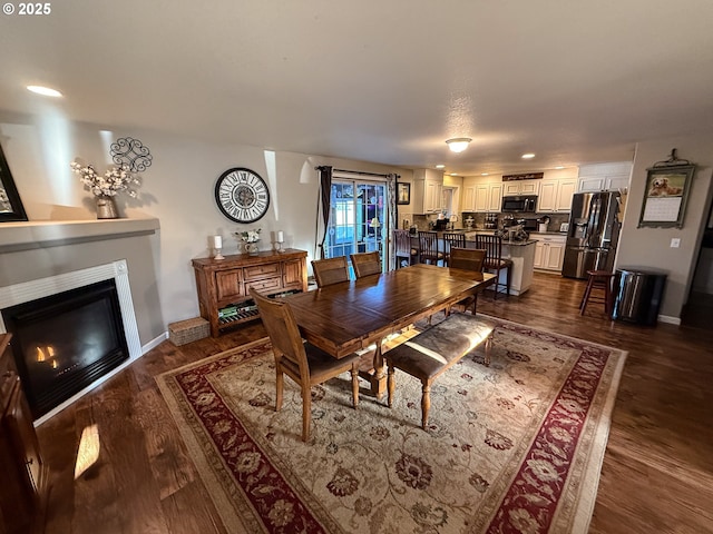 dining space with dark wood-type flooring