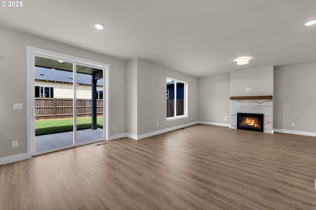 12216 NE 107th Way, Vancouver, WA 98682 - unfurnished living room with wood finished floors, a premium fireplace, and recessed lighting