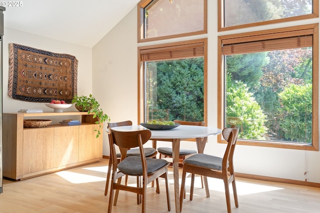 511 SW Colony Dr, Portland, OR 97219 - dining area with light wood finished floors and lofted ceiling