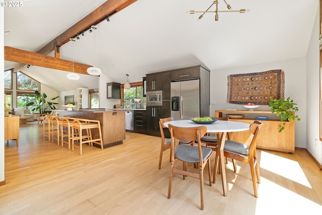 511 SW Colony Dr, Portland, OR 97219 - dining room with plenty of natural light, light wood-style flooring, and a chandelier