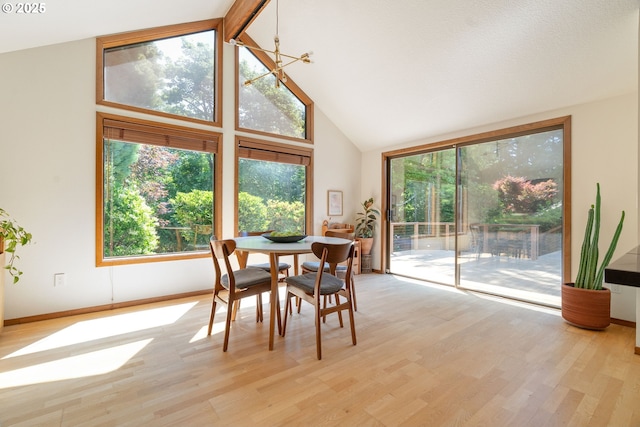 511 SW Colony Dr, Portland, OR 97219 - dining area with high vaulted ceiling and light wood-style flooring