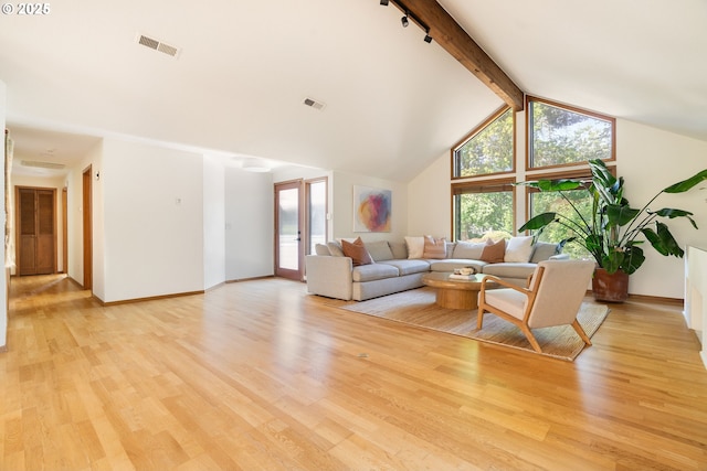 511 SW Colony Dr, Portland, OR 97219 - living area with beam ceiling, light wood-style flooring, and high vaulted ceiling
