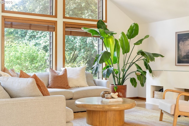 511 SW Colony Dr, Portland, OR 97219 - living area featuring plenty of natural light, wood finished floors, and lofted ceiling