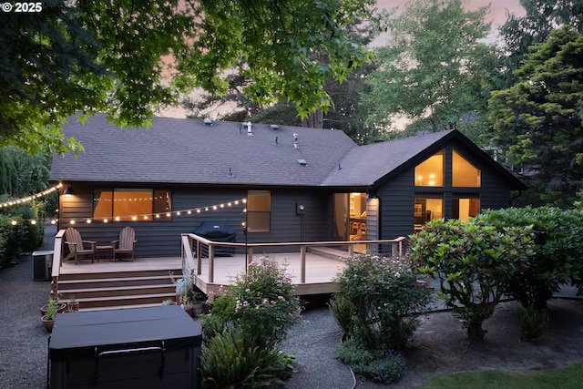 511 SW Colony Dr, Portland, OR 97219 - back of property at dusk featuring a deck and roof with shingles