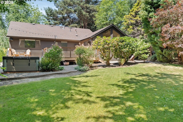 511 SW Colony Dr, Portland, OR 97219 - view of green lawn featuring a hot tub and a wooden deck