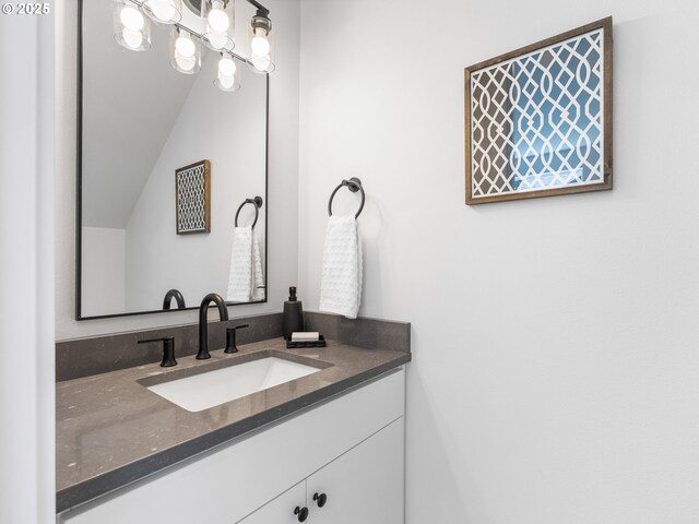 7244 SE 78th Ave Unit 2, Portland, OR 97206 - bathroom featuring vanity and vaulted ceiling