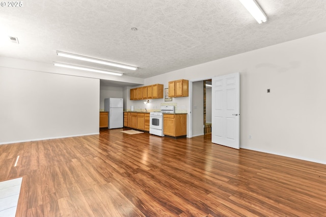 18183 SE Richey Rd, Gresham, OR 97080 - unfurnished living room featuring dark wood-style floors and a textured ceiling