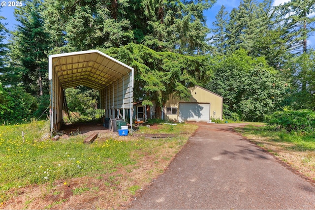 18183 SE Richey Rd, Gresham, OR 97080 - view of front facade featuring asphalt driveway, a garage, and a detached carport