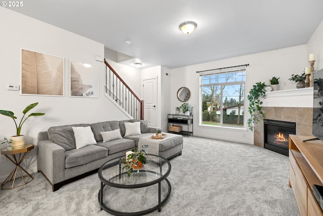 living room with light colored carpet and a fireplace