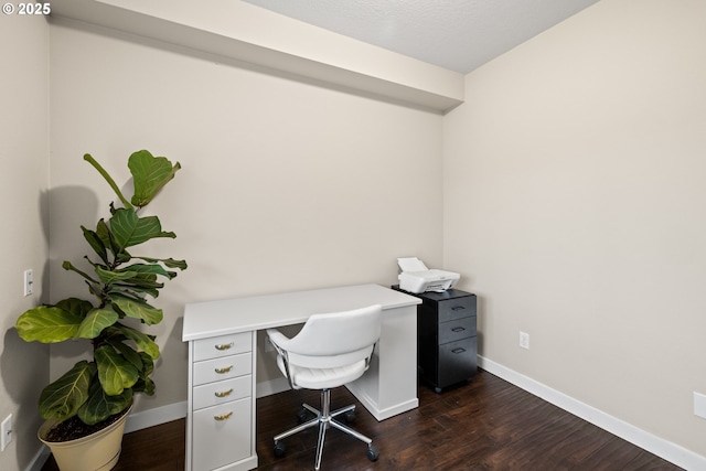 office area featuring dark wood-type flooring and a textured ceiling