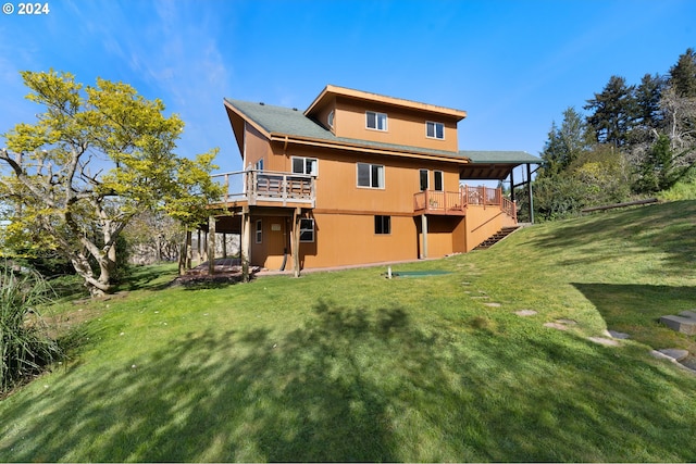 66599 Quail Rd, North Bend, OR 97459 - rear view of house featuring a deck, a lawn, and stairway