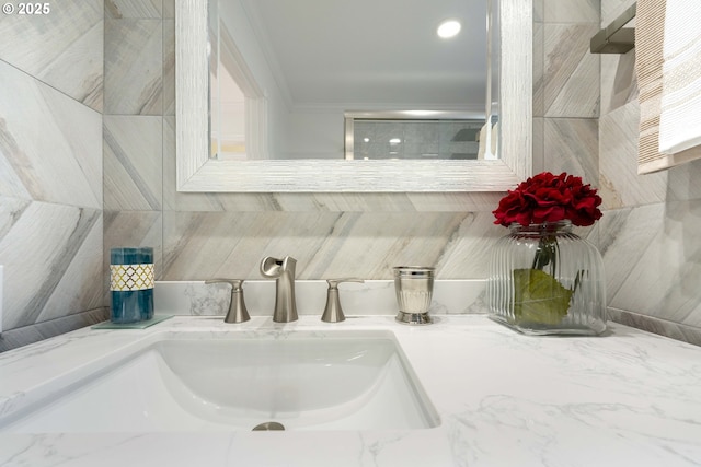 66599 Quail Rd, North Bend, OR 97459 - bathroom with decorative backsplash, ornamental molding, and vanity