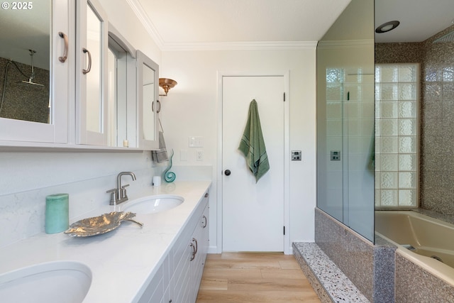 66599 Quail Rd, North Bend, OR 97459 - full bathroom featuring crown molding, tiled shower, a bathtub, double vanity, and wood finished floors