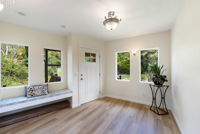66599 Quail Rd, North Bend, OR 97459 - entryway with healthy amount of natural light, light wood-style floors, and baseboards