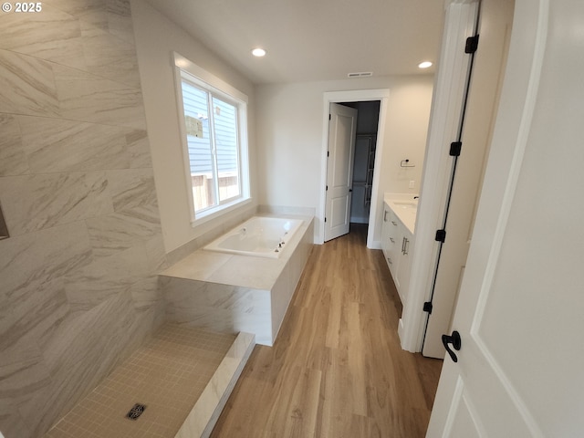 5602 N 93rd Ave Unit Lt205, Camas, WA 98607 - full bath with wood finished floors, a bath, vanity, and recessed lighting