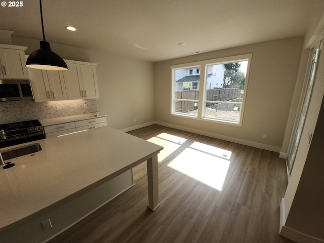 5602 N 93rd Ave Unit Lt205, Camas, WA 98607 - kitchen featuring stainless steel microwave, stove, white cabinets, recessed lighting, and dark wood-style flooring