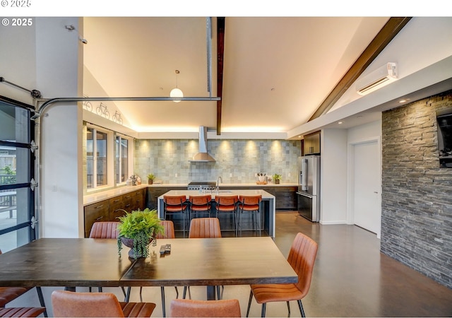 5602 N 93rd Ave Unit Lt205, Camas, WA 98607 - dining area featuring finished concrete floors, high vaulted ceiling, and a wall mounted air conditioner