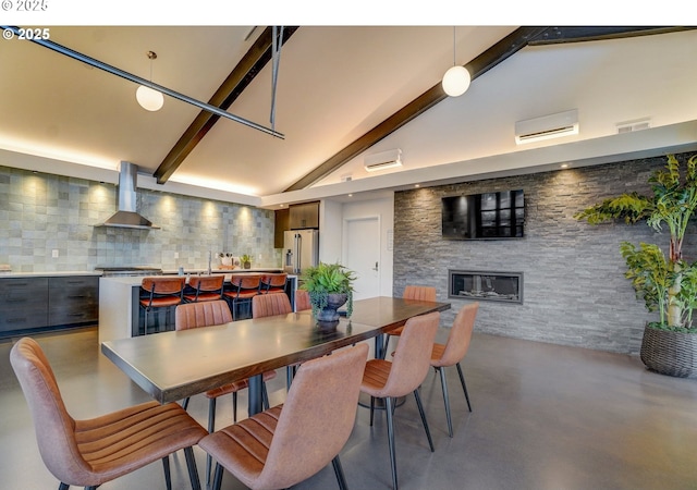 5602 N 93rd Ave Unit Lt205, Camas, WA 98607 - dining space featuring concrete floors, a wall mounted AC, and a glass covered fireplace