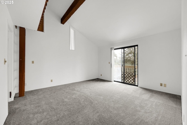 unfurnished room featuring vaulted ceiling with beams and carpet flooring