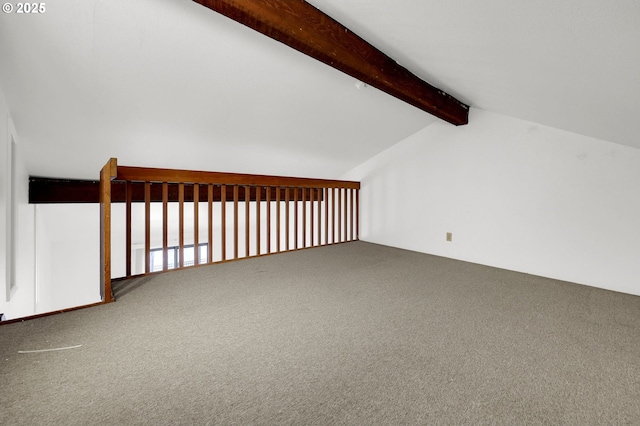 bonus room with lofted ceiling with beams and carpet flooring