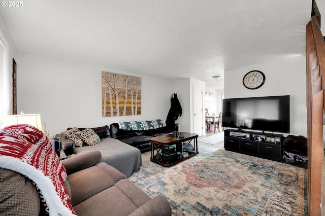 living area with a textured ceiling