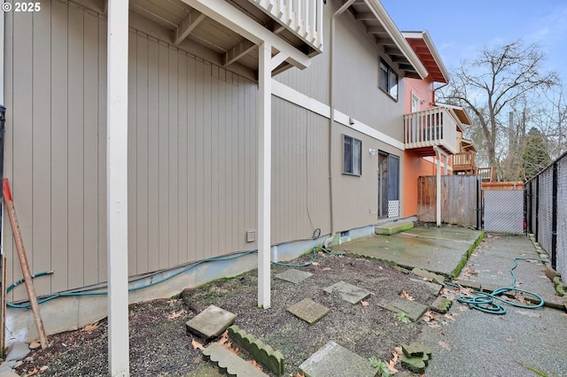 view of property exterior featuring fence