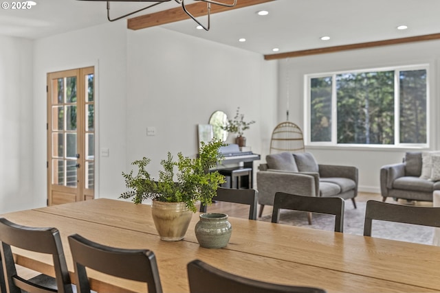 dining area featuring beamed ceiling and recessed lighting