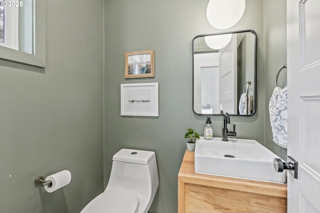 half bath with vanity and toilet