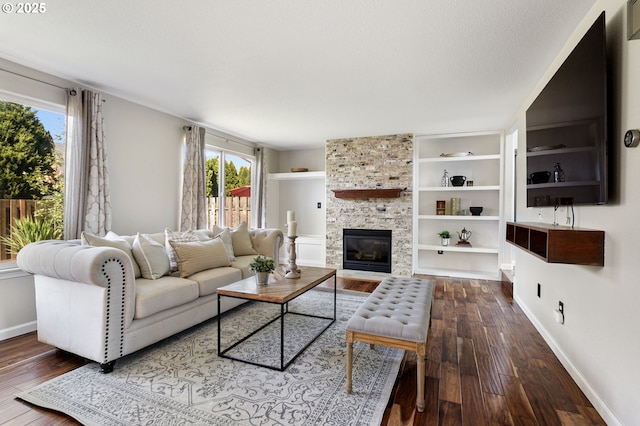 17006 SE 6th St, Vancouver, WA 98684 - living room featuring wood-type flooring, baseboards, a fireplace, and built in shelves