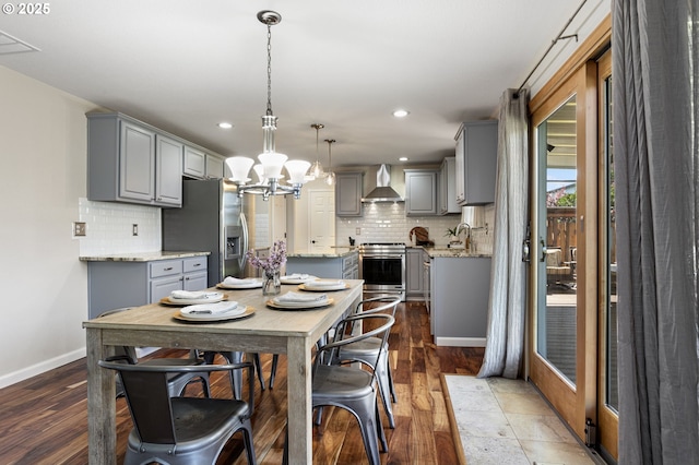 17006 SE 6th St, Vancouver, WA 98684 - dining space with baseboards, a chandelier, recessed lighting, and wood finished floors