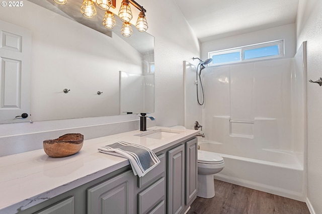 17006 SE 6th St, Vancouver, WA 98684 - bathroom with toilet, vanity, bathtub / shower combination, wood finished floors, and a chandelier