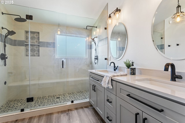 17006 SE 6th St, Vancouver, WA 98684 - full bathroom featuring double vanity, a shower stall, and wood finished floors