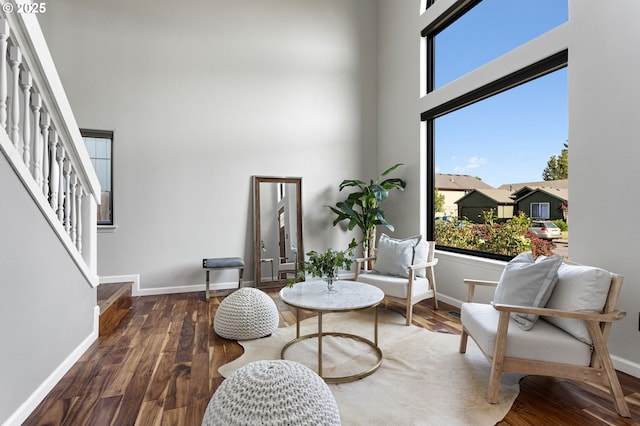 17006 SE 6th St, Vancouver, WA 98684 - sitting room with stairway, a towering ceiling, baseboards, and wood finished floors