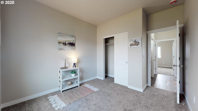 bedroom with light colored carpet and a closet