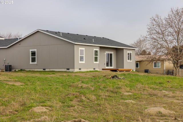 rear view of house with central AC