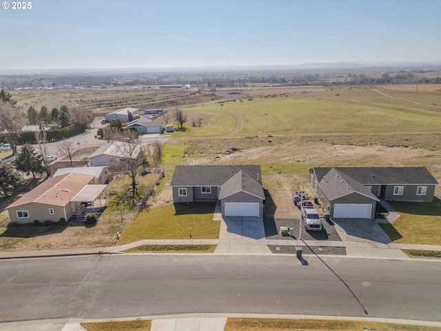 birds eye view of property featuring a rural view