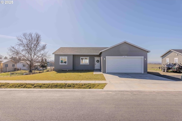 view of front facade featuring a shingled roof, concrete driveway, an attached garage, fence, and a front lawn