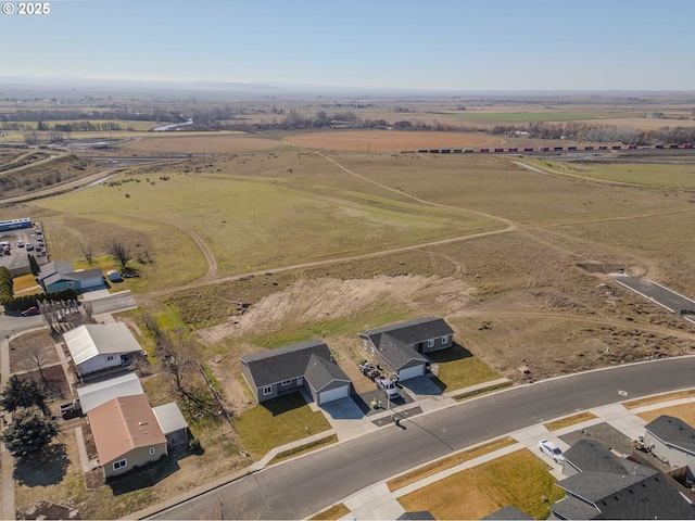 birds eye view of property featuring a rural view