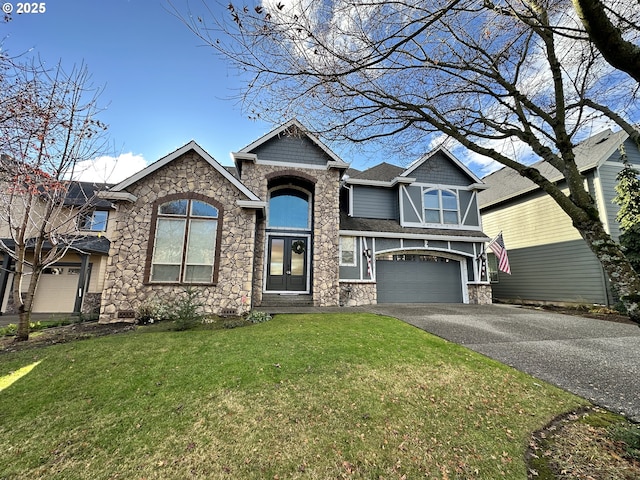 view of front of home with a garage and a front yard