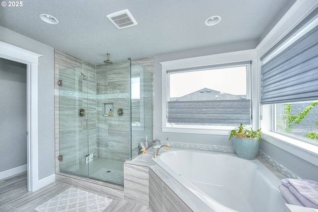 15928 Stables Pl, Oregon City, OR 97045 - full bathroom featuring recessed lighting, baseboards, visible vents, a garden tub, and a stall shower