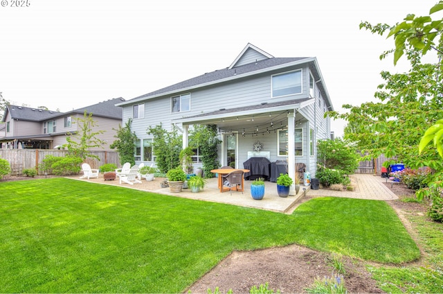 15928 Stables Pl, Oregon City, OR 97045 - rear view of house with a yard, a patio, and a fenced backyard