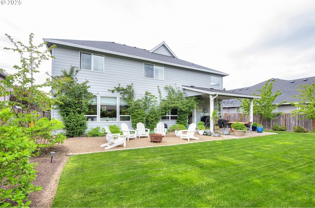 15928 Stables Pl, Oregon City, OR 97045 - back of property with a yard, fence, a fire pit, and a patio area