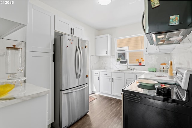 1605 SE 46th Ave, Portland, OR 97215 - kitchen featuring freestanding refrigerator, black electric range oven, range hood, white cabinets, and dark wood-style flooring