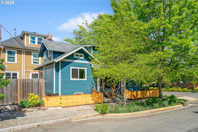1605 SE 46th Ave, Portland, OR 97215 - view of front of property featuring a fenced front yard and a chimney