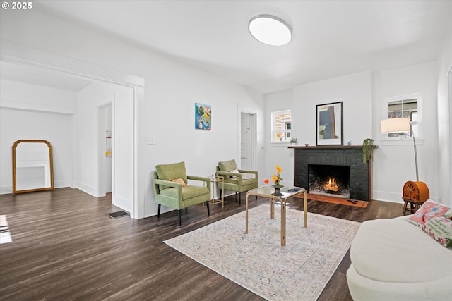 1605 SE 46th Ave, Portland, OR 97215 - living room with a fireplace and dark wood-type flooring