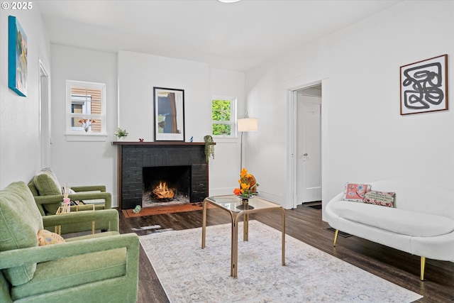 1605 SE 46th Ave, Portland, OR 97215 - living room featuring wood finished floors, plenty of natural light, and a brick fireplace