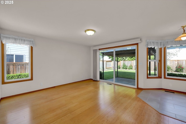 4095 Eddystone Pl, Eugene, OR 97404 - unfurnished room with plenty of natural light, light wood finished floors, and baseboards