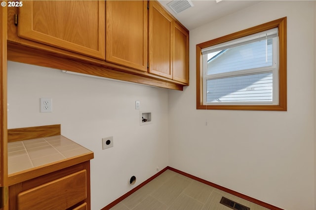 4095 Eddystone Pl, Eugene, OR 97404 - washroom featuring cabinet space, washer hookup, electric dryer hookup, and baseboards