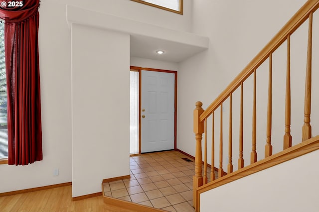 4095 Eddystone Pl, Eugene, OR 97404 - entryway featuring stairway, healthy amount of natural light, baseboards, a towering ceiling, and recessed lighting